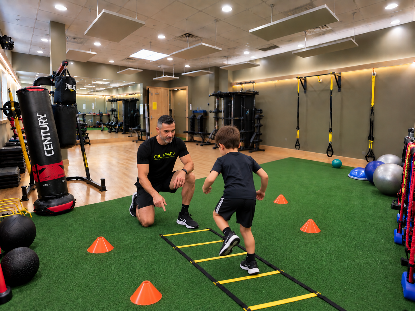 Coach training kids at QuadFit Club